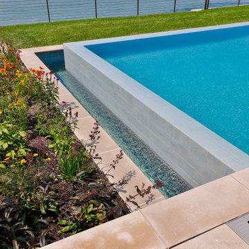 Lakeside Retreat with this Exquisite and Sophisticated Pool & Spa Oasis