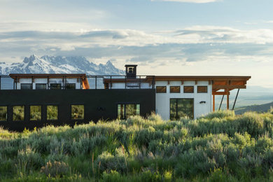 Industrial exterior home idea in Other