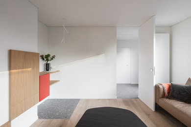 Example of a minimalist living room design in Other with white walls