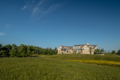Mid-sized beach style beige two-story mixed siding exterior home photo in Toronto