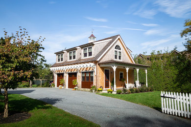 Small beach style beige two-story wood exterior home photo in Providence with a shingle roof