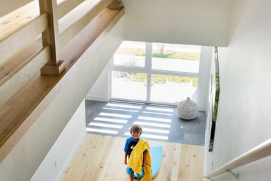 Beach style wooden straight staircase photo in Boston