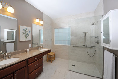 Large trendy master gray tile, white tile and marble tile marble floor and white floor bathroom photo in St Louis with shaker cabinets, dark wood cabinets, brown walls, an undermount sink, solid surface countertops and brown countertops