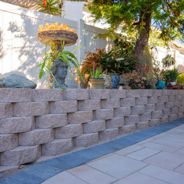 Elegant Outdoor Transformation with Retaining Wall & Paver Design