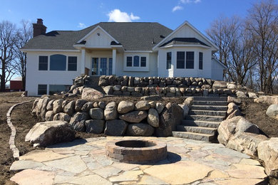 Inspiration for a large timeless white two-story wood exterior home remodel in Minneapolis with a shingle roof
