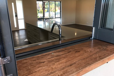 This is an example of a modern kitchen in Canberra - Queanbeyan with terrazzo benchtops.