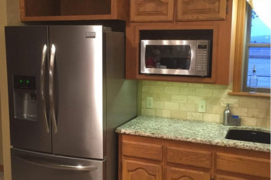 Example of a classic kitchen design in Other