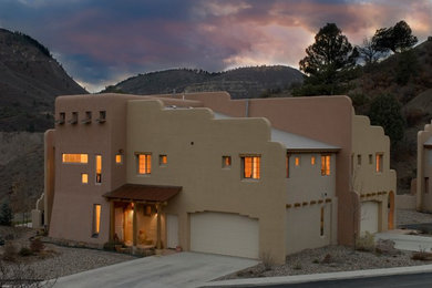 Example of a tuscan exterior home design in Denver