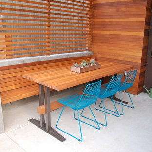 This is an example of a modern patio in Seattle with an outdoor kitchen.