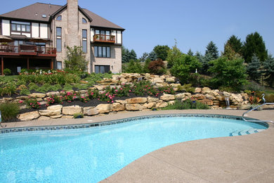 Inspiration for a large contemporary backyard full sun garden for summer in Other with concrete pavers.