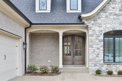 Example of a transitional exterior home design in Louisville