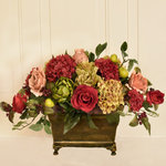 Floral Home D�cor - Hydrangea, Rose, and Artichoke Centerpiece - Our designers have created this colorful centerpiece with roses, hydrangeas, fruit and artichokes.   The  lower height is  perfect for leaving on your dining table when entertaining or for a coffee table.  Made in a metal  footed planter in a cherry color to compliment the flowers. Measures 14" H x 23"L x 12 " D