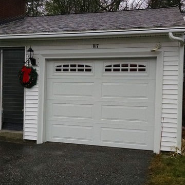 White Overhead Garage Door With Arched Windows