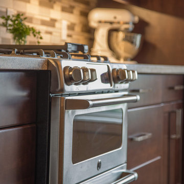 Falsetta - Brown Cabinets with Mosaic Tile Backsplash