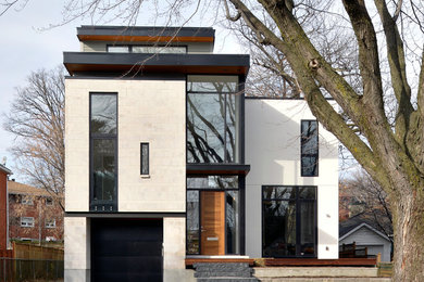 This is an example of a modern white exterior in Ottawa with a flat roof.