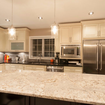 Fabuwood ivory wellington kitchen w/ chocolate maple island by Luxcraft Cabinets