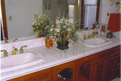 White tile ceramic tile bathroom photo in San Francisco with medium tone wood cabinets