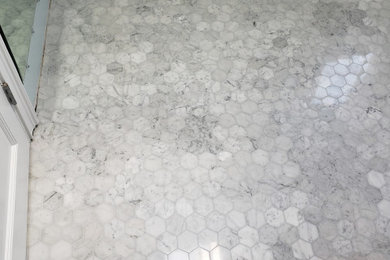 Mid-sized master gray tile and glass tile marble floor and white floor corner shower photo in Orange County with a niche and a built-in vanity
