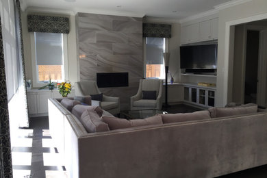 Transitional family room photo in Toronto