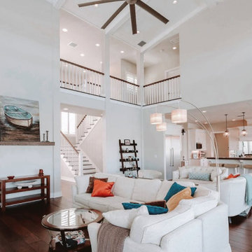 Grand Open-Concept Living Room With Loft and Modern Coastal Accents
