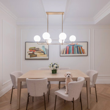 Dining Room with Modern Lighting and Wall Art