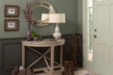 Example of a mid-sized transitional ceramic tile entryway design in Other with blue walls and a white front door