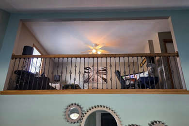 Staircase - mid-sized straight wood railing staircase idea in Cleveland
