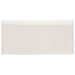 Merola Tile - Antic Craquelle Bullnose White Ceramic Wall Trim - Our Antic Craquelle White Ceramic Bullnose Wall Trim Tile is a wall trim tile that features a beautiful creamy white glaze and a smooth and glossy surface. The subtle crackle appearance within the glaze creates stunning visual interest. This tile features uneven, slightly round edges for a handmade-look. The active glaze on this tile makes every piece unique, so you will never have two that are exactly the same. Use this bullnose trim with many of our other products, including those in the Antic Collection to complete an elegant look. Please note it is necessary that you seal this tile before grouting to prevent the absorption of staining agents over time. This tile is suitable for indoor wall use only.