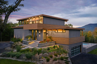 Inspiration for a contemporary gray concrete fiberboard house exterior remodel in New York
