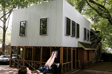 Large danish white two-story wood exterior home photo in Raleigh