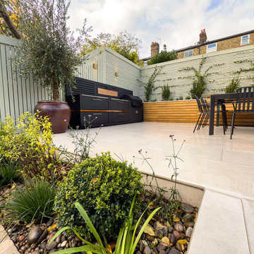 Classical  Contemporary Garden in London with an Outside Kitchen
