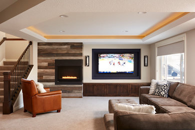 Photo of a mid-sized traditional open concept family room in Minneapolis with beige walls, carpet, a corner fireplace, a wood fireplace surround, a wall-mounted tv and beige floor.