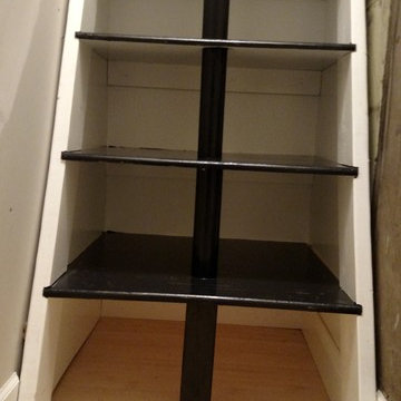 Storage ships ladder in a brownstone walk-up