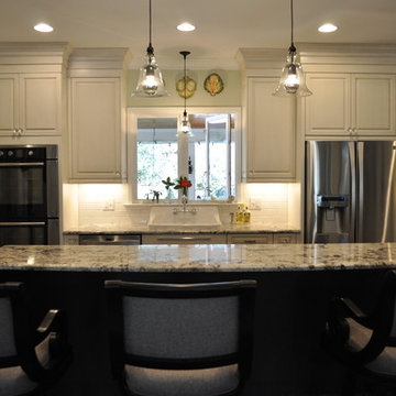 Brush-stroke painted kitchen with red brick floor