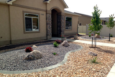 Photo of a small traditional drought-tolerant and full sun front yard gravel garden path in Denver for summer.