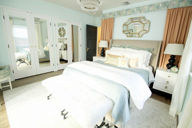 Inspiration for a mid-sized timeless master dark wood floor bedroom remodel in Los Angeles with blue walls and no fireplace