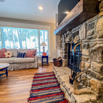 Rustic Accents to Stone Fireplace in Living Room