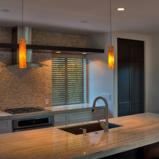 Mid-sized transitional kitchen pantry appliance - Kitchen pantry - mid-sized transitional single-wall medium tone wood floor kitchen pantry idea in San Luis Obispo with an undermount sink, recessed-panel cabinets, dark wood cabinets, tile countertops, beige backsplash, stone tile backsplash, stainless steel appliances and an island