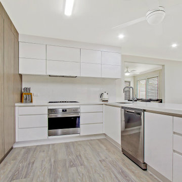 White Cabinets With Finger Pull Drawers and Cupboards