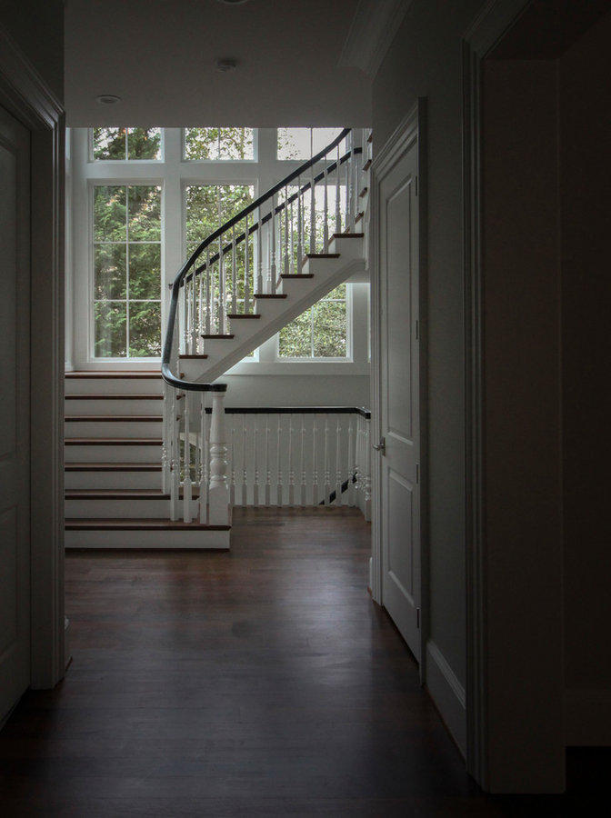 Powerful Impression by Floating Staircase in Suburban Foyer
