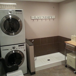 Medium sized eclectic single-wall separated utility room in Vancouver with wood worktops, beige walls, lino flooring and a stacked washer and dryer.