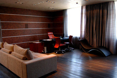 Inspiration for a large industrial freestanding desk dark wood floor craft room remodel in Moscow with red walls