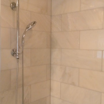 BATHROOM - Calcutta Gold Marble Shower / Gray Penny Tile Floor