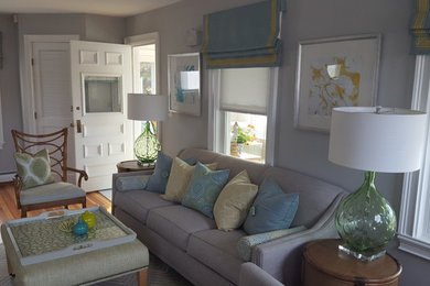 Mid-sized beach style formal and enclosed medium tone wood floor and brown floor living room photo in Boston with gray walls, no fireplace and no tv