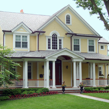 Yellow Victorian Farmhouse with Front Porch