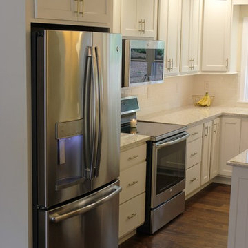 Davenport, IA- White Painted Kitchen With Gold Accents and Large Island