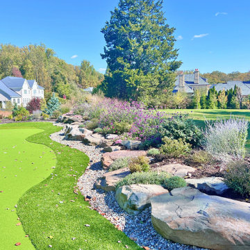 Side Yard Putting Green with Boulder retaining wall and Botanical Garden Perimet
