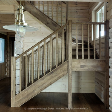 Photography of wooden stairs installed in a log house near Vilnius.