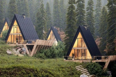 Свежая идея для дизайна: маленький, двухэтажный, черный мини дом в современном стиле с двускатной крышей, черепичной крышей и черной крышей для на участке и в саду - отличное фото интерьера