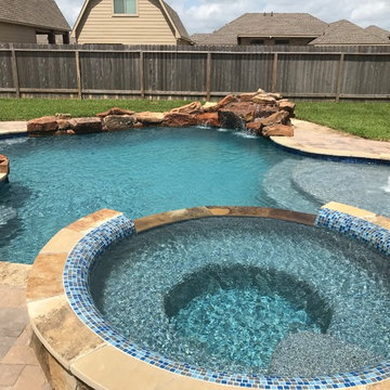 Cozy Lagoon pool with jump rocks and waterfall